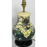 A contemporary Moorcroft cream ground Bulrush pattern lamp with original tag, height 37cm.