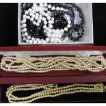 A quantity of costume jewellery to include brooches, necklaces etc.