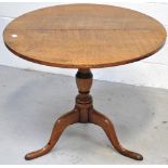 An early 19th century oak tripod occasional table, diameter 79cm.