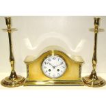 An early 20th century French brass mantel clock and a pair of brass candlesticks (3).