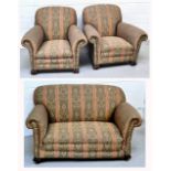An early 20th century three piece lounge suite comprising a two seat sofa and two arm chairs