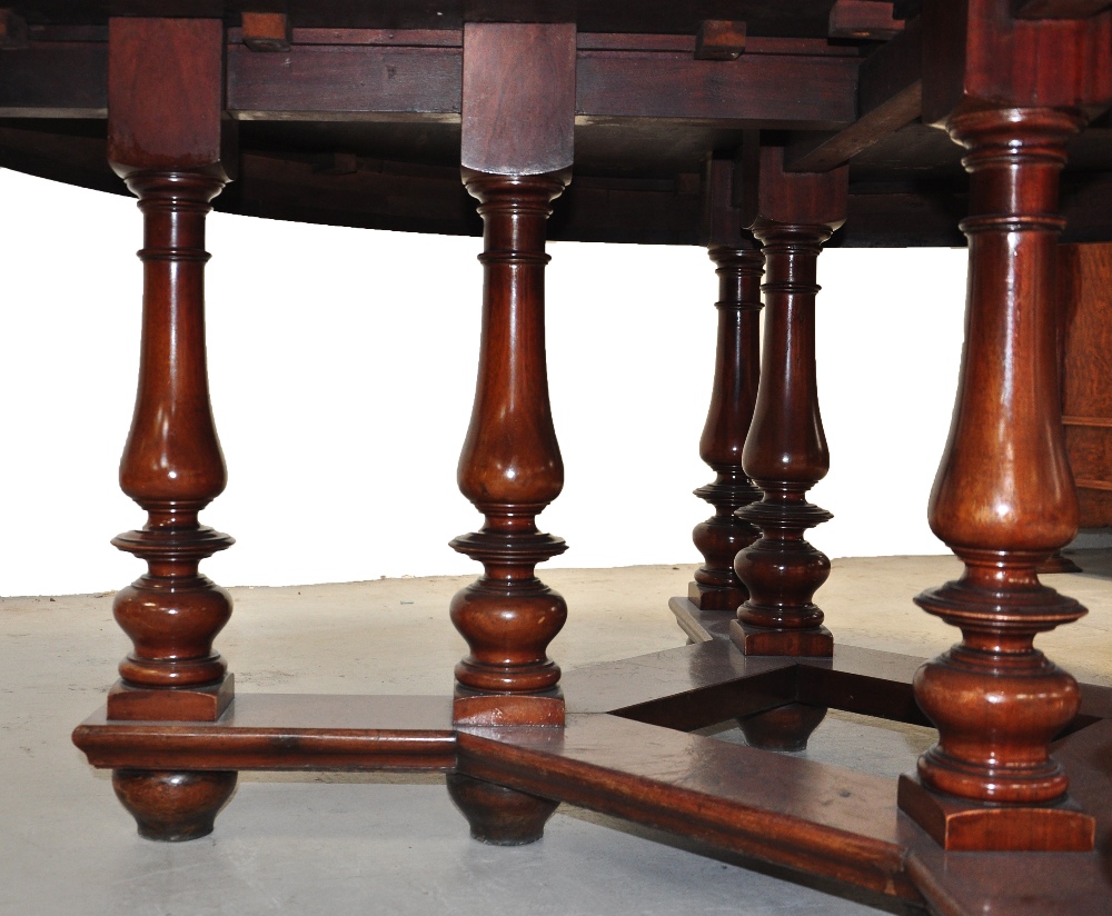 A late 19th century circular mahogany dining table supported on ring turned legs with six cane - Image 6 of 6