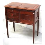 A late 19th century mahogany sewing cabinet/table on square sectioned tapering legs,