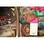 Two boxes of collectibles to include vintage tins,