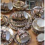 A quantity of Royal Crown Derby, Imari pattern cups, saucers and plates.