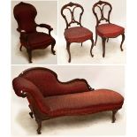 A Victorian walnut four piece salon suite comprising scroll arm chaise longue,