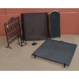 A contemporary fire screen, another, companion tools, etc.