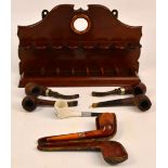 A small collection of pipes including "Duncan", "Bruyere St Claude", "Super Bent",