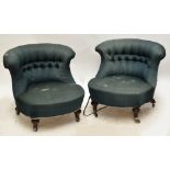 A pair of late Victorian shaped button backed tub chairs raised on ring turned front legs to brass