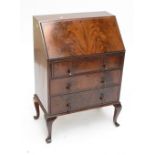 An early 20th century mahogany three drawer bureau.