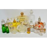 Ten clear glass pharmacy jars with stoppers,