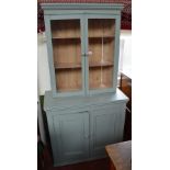 An associated painted pine bookcase on cupboard.