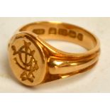 An 18ct yellow gold gentleman's signet ring with monogrammed seal face, size N, approx 7.9g.