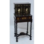 An early 19th century ivory inlaid and ebonised cabinet on stand, probably North Italian,