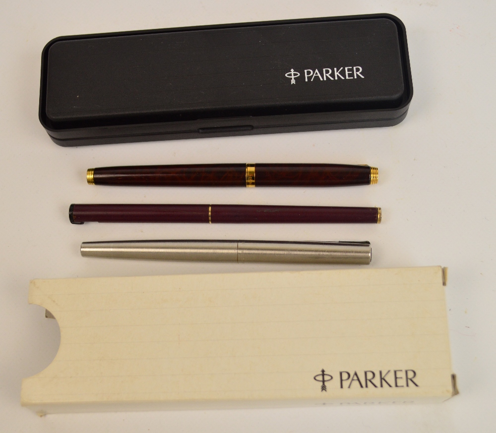 A cased Parker rolled gold fountain pen and pencil set with engine turned decoration, two further