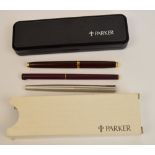A cased Parker rolled gold fountain pen and pencil set with engine turned decoration, two further