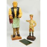 A composition restaurant display figure modelled as a waiter,