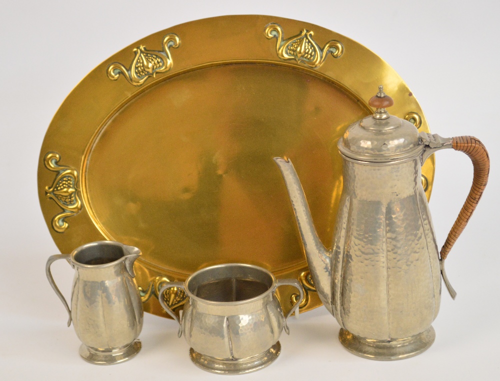 A three piece Tudric Pewter coffee service comprising coffee pot of lobed baluster form with