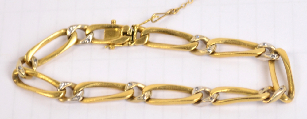 An 18ct gold diamond chip set open work bracelet, length 19.5cm, approx 22.6g.