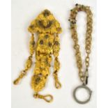 A yellow metal chatelaine clasp with four central panels decorated with angels, flowers and figures,