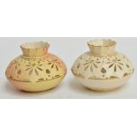 A pair of Locke & Co Worcester part reticulated squat circular vases with fluted rims, one blush