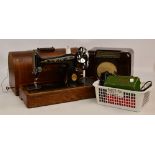 A vintage Bush radio, an angle poise lamp and a Singer sewing machine with accessories.