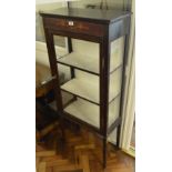 An Edwardian mahogany rectangular display cabinet with single glazed door enclosing two shelves on