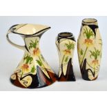 Three pieces of Black Ryden floral painted pottery comprising vase, height 21cm, dated 2003,