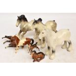Seven Beswick figures of horses; two shire mares, no.818, grey and rocking horse grey, cantering