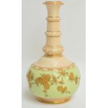 A large Locke & Co. Worcester bottle vase with gilt pine cone decoration on pale green ground and