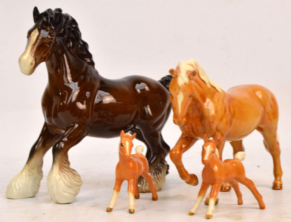 Four Beswick figures of horses; palomino stocky jogging mare, no.855 (third version), two foals, (