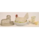 A 19th century hen basket bowl and cover, a glass mould in the form of a seated dog,