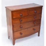 A Victorian mahogany chest of two short and three long drawers raised on splay bracket feet.