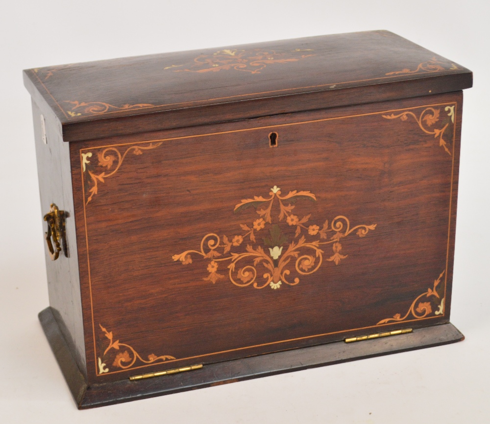 An Edwardian rosewood and inlaid rectangular writing box, with hinged lid above fall front enclosing