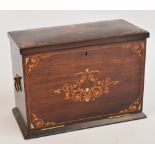 An Edwardian rosewood and inlaid rectangular writing box, with hinged lid above fall front enclosing