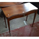 A George III mahogany tea table of serpentine outline,