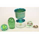 A Victorian green glass dump, height 13cm, and three other glass paperweights,