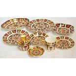 Nine pieces of Royal Crown Derby Imari decorated ware, comprising four plates of various sizes, an
