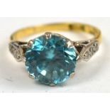 An early 20th century 18ct yellow gold dress ring set with large brilliant cut pale blue topaz,