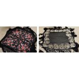 An early 20th century large black tasseled shawl with brightly coloured floral and bird