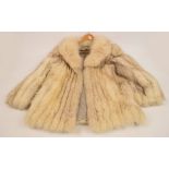 A vintage ladies silk lined Arctic fox fur coat, size 10/12. CONDITION REPORT: In a good condition.