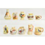 A collection of Locke & Co. Worcester blush ivory miniature vessels of various shapes and sizes,