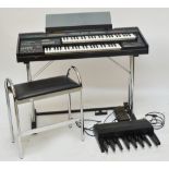 An Elka X45 electric organ on stand, with pad seat stool (2).