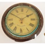 An early 20th century mahogany cased circular thirty hour wall clock with circular dial inscribed "