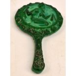 An Art Deco malachite glass mounted hand mirror decorated with a  nude within a border of roses,