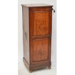 A Victorian mahogany single door cupboard enclosing two shelves on plinth base,