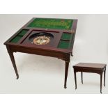 An Edwardian mahogany double folding games table, the hinged rectangular lid opening to reveal a