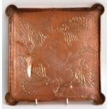 HERBERT DYER (1898-1974); an Arts and Crafts square hammered copper tray with lobed corners,