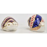 Two Royal Crown Derby paperweights; snail and hedgehog, both with gold stoppers,