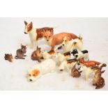 Ten Beswick figures; cocker spaniel "Horseshoe Primula", no.967, terrier (lying), no.1061,